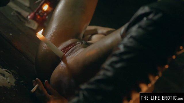 Sexy brunette squirting as she fucks herself with a lit candle