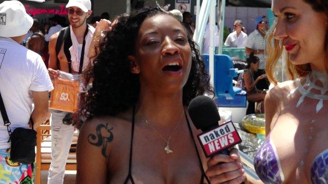 Naked News reporter in mermaid body paint at Xbiz Miami interviews