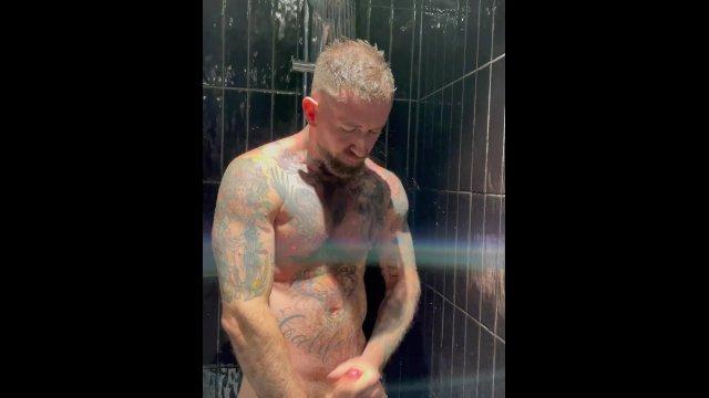tatted muscle man Troy Daniels jacking off in the shower