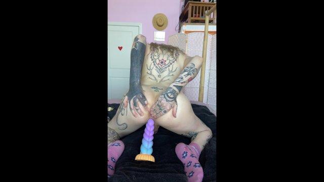 Oiled up T-girl rides a unicorn horn